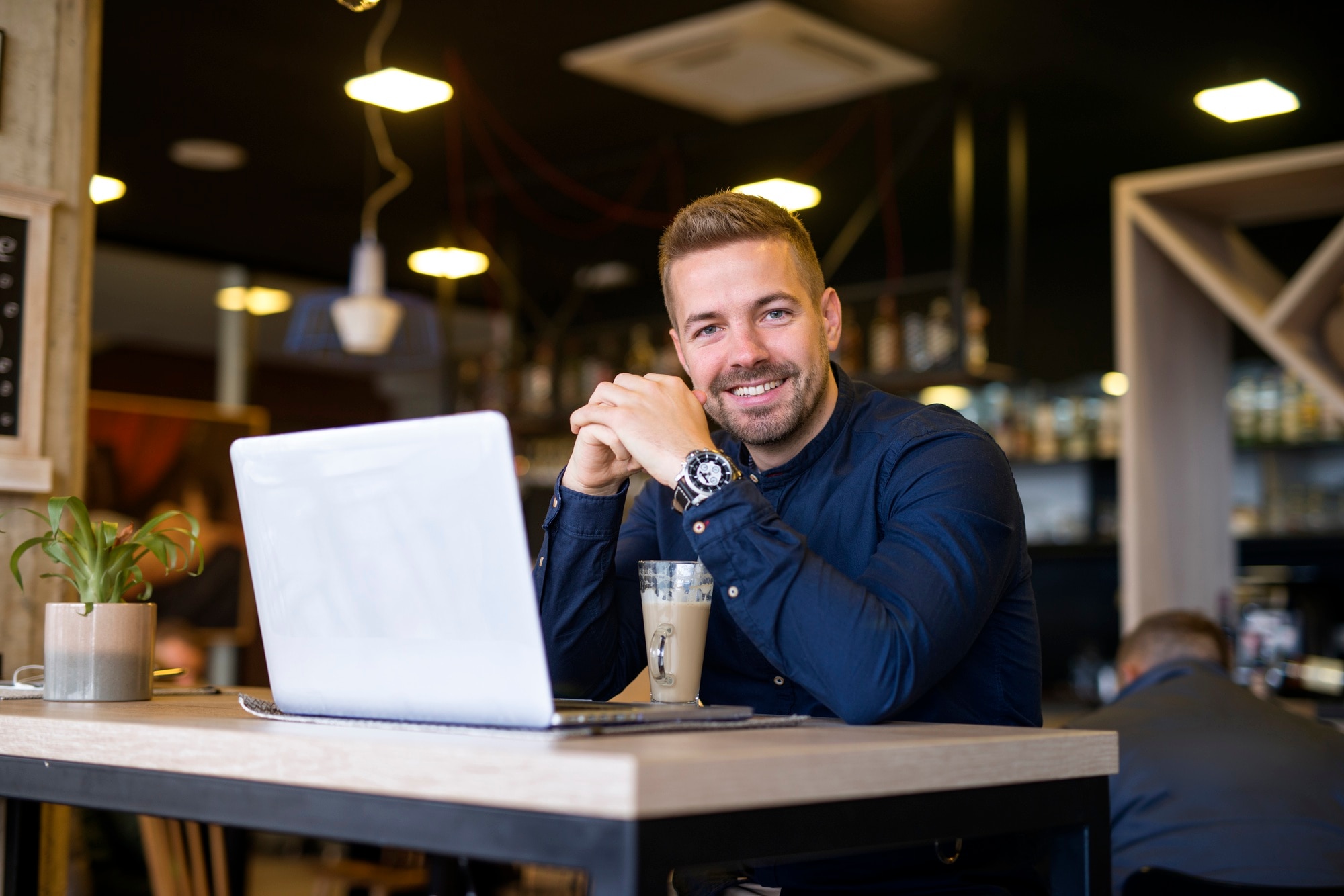 Business owner reviewing equipment financing options on a laptop